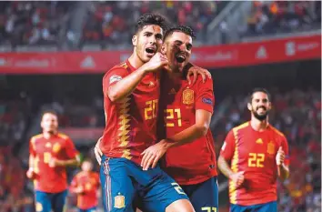  ?? AFP ?? Spain’s Marco Asensio celebrates with Dani Ceballos after scoring a goal during the Uefa Nations League match against Croatia on Tuesday.