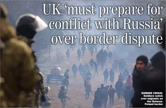  ?? Picture: RAMIL NASIBULIN/AFP/GETTY ?? BORDER CRISIS:
Soldiers watch over migrants on
the Belaruspol­and border