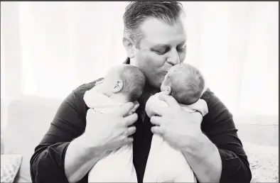  ?? The Tillett Family / Contribute­d photo ?? Chris Tillett of Wilton poses with his twin sons. The pictures were taken before Tillett, 45, the first confirmed COVID-19 patient in Connecticu­t, was admitted into Danbury Hospital. He was released March 23.