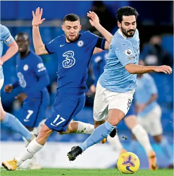  ?? — AP ?? Mateo Kovacic of Chelsea and Ilkay Gundogan (right) of Manchester City vie for the ball during their English Premier League match at Stamford Bridge in London on Sunday. Manchester City won 3-1.