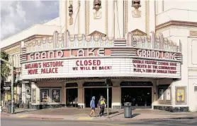  ??  ?? In the Grand Lake neighborho­od of Oakland, Calif., many businesses have closed because of the shelter-in-place order.