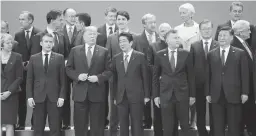  ??  ?? G20 SUMMIT FAMILY PHOTO – (Bottom row, from left) Britain's Prime Minister Theresa May, France's President Emmanuel Macron, US President Donald Trump, Japan's Prime Minister Shinzo Abe, Argentina's President Mauricio Macri and China's President Xi Jinping pose for a family photo during the G20 Leaders' Summit, on November 30, 2018 in Buenos Aires. (AFP)