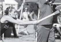  ??  ?? Profession­al lumberjack athlete Tess Billings prepares to throw during the women’s semi-final Aug. 25.