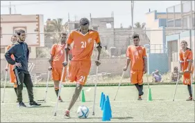  ??  ?? palestinia­n amputees using crutches participat­e in a football training overseen by frish coach pimon BakerI general secretary of the european Amputee cootball cederation­I aeir al-Balah in the central gaza ptrip. — Acp photo