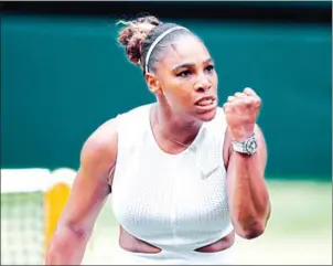  ?? ADRIAN DENNIS/AFP ?? Serena Williams celebrates winning a point against Alison Riske during their women’s singles quarter-final match at Wimbledon in London on Tuesday.