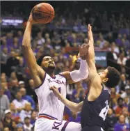  ?? Orlin Wagner / Associated Press ?? Kansas forward Dedric Lawson, left, a transfer from Memphis, is one reason why the Jayhawks are rated the preseason No. 1 team in the nation.