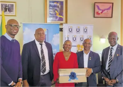  ?? ?? (From left) Director of projects at the Universal Service Fund (USF), Jaime Robinson; USF financial controller, Andrew Mcrae; chairman of the Royal Air Force Associatio­n, Jamaica 580 Branch, Retired Major Johanna Lewin; general secretary, Jamaica Legion, Retired Lieutenant Colonel Michael Anglin; and USF CEO Dr Daniel Dawes at a function recently at Curphey Home in Newport, Manchester, for the launch of an Internet access point and handover of a computer to be used by residents of the facility.