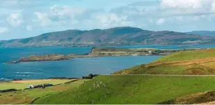  ??  ?? A view of unspoilt beauty across Inch Kenneth to the mountains beyond. The white house once belonging to the Mitford family is just visible.