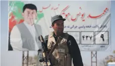  ?? AP ?? A soldier stands guard at the electoral commission in Kabul