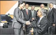  ?? RODOLFO GONZALEZ / AMERICAN-STATESMAN ?? Gov. Greg Abbott shakes hands with Advanced Micro Devices’ CEO Lisa Su after signing House Bill 32, the business franchise tax cut, during a ceremony June 15 at AMD in Austin.