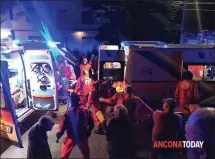  ?? STEFANO PAGLIARINI — ANCONA TODAY VIA AP ?? Rescuers assist injured people outside a nightclub in Corinaldo, central Italy, on Saturday. Six people died when the crowd stampeded.