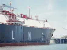  ?? Jon Shapley/staff file photo ?? A large liquefied natural gas transport ship docks in June in the Calcasieu River near Cameron, La. Four multibilli­on-dollar LNG export projects are in limbo over permits.