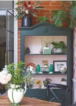  ??  ?? GARDEN ROOM
Ruthie repainted this vintage cabinet in colours that echo the tones in the wallpaper. Cabinet in Stable Green oil eggshell, £72 for 2.5ltr, Paint & Paper Library and Calamine estate eggshell, £64 for 2.5ltr, Farrow & Ball