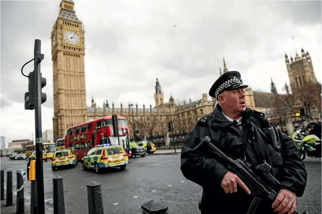  ?? PHOTO: GETTY IMAGES ?? An armed police officer stands guard near Westminste­r Bridge and the Houses of Parliament after a police officer was stabbed and the alleged assailant was shot by police.
