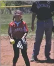  ?? ?? Aleah Vigil breaks into laughter during the follow through phase of her pitch on Sunday (May 15).