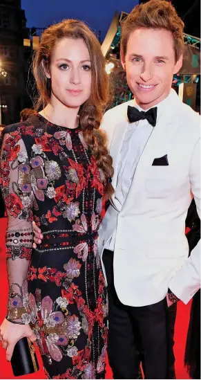  ??  ?? Followed: Eddie Redmayne with his wife Hannah Bagshawe