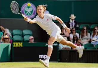  ?? Kirsty Wiggleswor­th / Associated Press ?? Sebastian Korda of the U.S. plays a return to Britain's Daniel Evans during their third-round match on Friday. Korda won the match 6-3, 3-6, 6-3, 6-4.