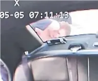  ??  ?? A screengrab from Toronto police dash cam footage shows then-Sgt. Douglas Campbell holding Shawn Blanchard, 51, against a police cruiser on May 5, 2018.