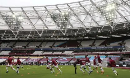  ??  ?? West Ham players prepare for action in an empty London Stadium. Photograph: Paul Childs/AFP/Getty Images