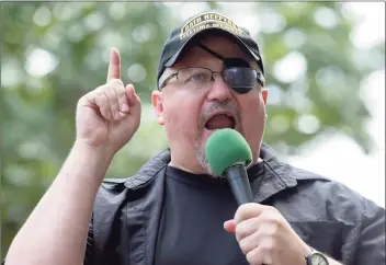  ?? Susan Walsh / Associated Press ?? At right, Stewart Rhodes, founder of the citizen militia group known as the Oath Keepers and an Army veteran, had been saying for weeks before the Capitol riot that his group was preparing for a civil war and was “armed, prepared to go in if the president calls us up.”