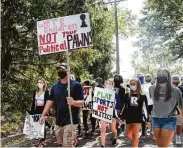  ?? Olivia Sun / Des Moines Register via AP ?? Des Moines Public School students and supporters march on Sept. 7 to the governor’s mansion to protest the cancellati­on of fall and winter extracurri­cular activities in Des Moines, Iowa.