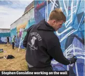  ??  ?? Stephen Considine working on the wall