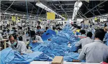  ?? ?? THE production line of a garment factory in Indore, India. Mile 91/C & A Foundation/Alamy Stock Photo