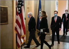  ??  ?? U.S. Senate Minority Leader Mitch Mcconnell (R-KY) arrives in his office after speaking on the Senate floor in the U.S. Capitol on the fifth day of the impeachmen­t trial of former U.S. President Donald Trump, on charges of inciting the deadly attack on the U.S. Capitol, in Washington, U.S., 13 February 2021. REUTERS