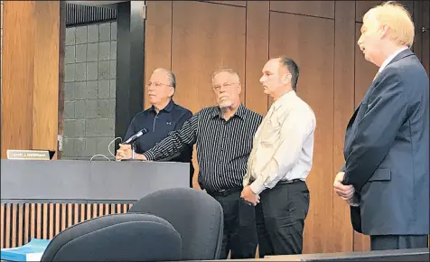  ?? CRAIG LYONS PHOTOS/POST-TRIBUNE PHOTOS ?? St. John Republican town council candidates Wayne Pondinas, Bryan Blazak and Paul Panczuk and attorney J. Justin Murphy on Saturday discuss the reasons a complaint against the three candidates should be dismissed.