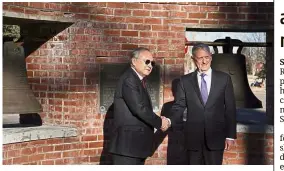  ?? — AP ?? Mending ties: Romualdez (left) and Mattis posing in front of the Bells of Balangiga at F.E. Warren Air Force Base in Cheyenne, Wyoming.