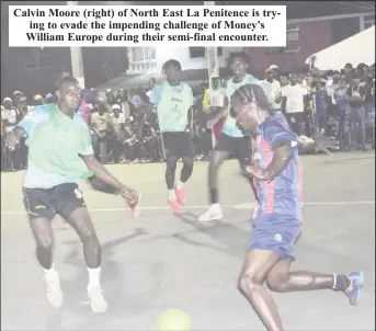  ?? ?? Calvin Moore (right) of North East La Penitence is trying to evade the impending challenge of Money’s William Europe during their semi-final encounter.