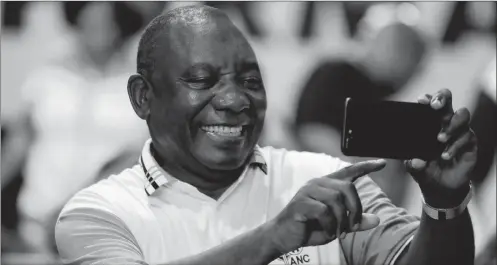  ?? PHOTO: AP ?? Newly elected ANC president Cyril Ramaphosa takes a selfie after it was announced that he had won the vote at the ANC’s elective conference in Johannesbu­rg, on Monday. Ramaphosa promises changes that will jump start the struggling economy, says the writer.