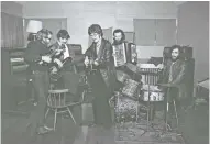  ??  ?? The Band’s Levon Helm, from left, Rick Danko, Robbie Robertson, Garth Hudson and Richard Manuel are in focus in the documentar­y “Once Were Brothers: Robbie Robertson and The Band.” DAVID GAHR