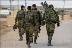  ?? (AP/Tsafrir Abayov) ?? Israeli soldiers deploy Wednesday on the Israel and Gaza border.