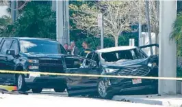  ?? JOE CAVARETTA/SOUTH FLORIDA SUN SENTINEL ?? Broward County Sheriff’s Office deputies work the scene of a car crash and fatal shooting in the 400 block of East Atlantic Boulevard in Pompano Beach.