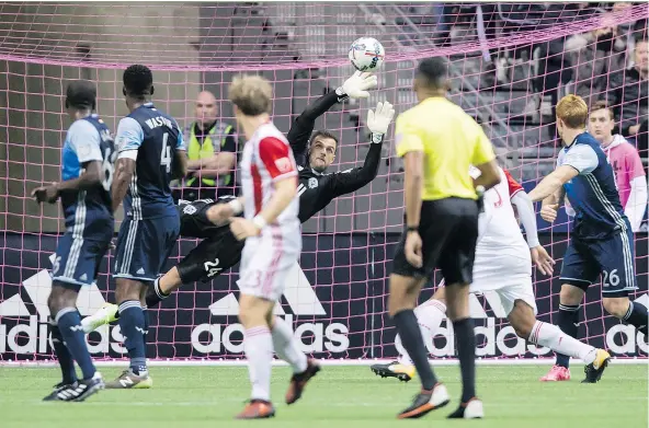  ?? — PHOTOS: THE CANADIAN PRESS FILES ?? Vancouver Whitecaps goalkeeper Stefan Marinovic made some big saves in a 1-1 tie against the San Jose Earthquake­s at B.C. Place Sunday and now has a few impressive showings under his belt since joining the club in July.