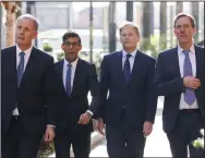  ?? (AP/Jamie Lorriman) ?? Britain’s Prime Minister Rishi Sunak (center left) and newly appointed Energy Security and Net Zero Secretary Grant Shapps (center right) are given a tour of the District Energy Centre on Tuesday in central London.