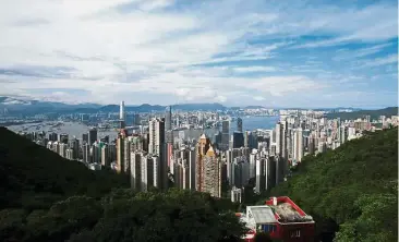  ?? — Reuters ?? Killer vista: A general view of Victoria Harbour and downtown skyline is seen from the Peak. Soaring home prices have put Hong Kong in bubble risk territory.