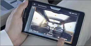  ??  ?? Many of the car’s functions can be operated by a detachable tablet.