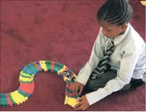  ?? PICTURE: AP ?? A child plays with Lego at Cotlands, which offers adoption services and early childhood education.