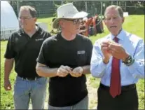  ??  ?? U.S. Sen. Richard Blumenthal visited Pioneer Hops in Morris Wednesday to speak with local hops farmers and beer brewers. Above, Blumenthal and Pioneer Hops owner Doug Weber take a look at the farm’s bounty.