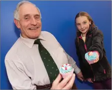  ??  ?? Rosie Coad with her grandad Michael Ryan at her special celebratio­n in the Coral Leisure Centre, Wicklow town.