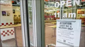  ?? Andrew Rush/Post-Gazette ?? Signs on the Market Square Five Guys location near Market Square in Downtown Pittsburgh on the first business day after Pennsylvan­ia Gov. Tom Wolf ordered all restaurant­s and bars in Allegheny and other counties to closed March 16.