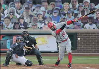  ?? Ted S. Warren Associated Press ?? IN HIS FIRST major league at-bat, Jo Adell bounces an infield single in the first inning. Angels manager Joe Maddon says Adell, the team’s top prospect, will be playing regularly in the outfield.