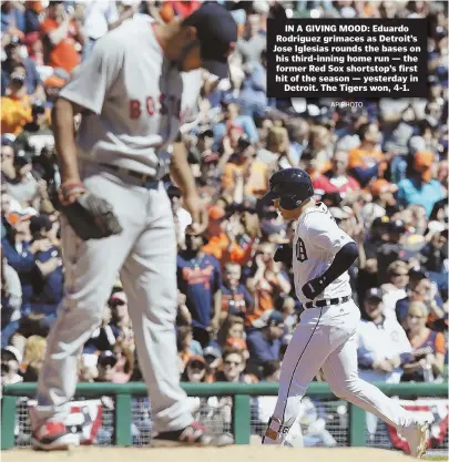  ?? AP PHOTO ?? IN A GIVING MOOD: Eduardo Rodriguez grimaces as Detroit’s Jose Iglesias rounds the bases on his third-inning home run — the former Red Sox shortstop’s first hit of the season — yesterday in Detroit. The Tigers won, 4-1.