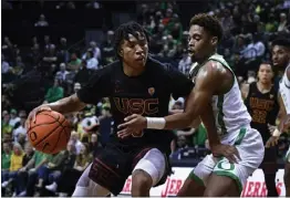  ?? ANDY NELSON — THE ASSOCIATED PRESS ?? Boogie Ellis, left, and his USC teammates will look to get right today against Oregon State following Thursday night's lopsided loss to Oregon.