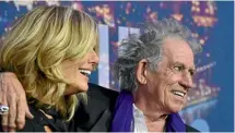  ??  ?? Rolling Stones guitarist Keith Richards and wife Patti Hansen. Richards recalls a ‘‘meeting’’ with Donald Trump when he promoted a Rolling Stones’ tour in the United States.