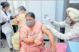  ??  ?? Elderly women get the second dose of Covid-19 vaccines in Patiala on Thursday.