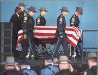  ??  ?? State troopers carry the casket of fellow trooper Sgt. Brian Mohl during his funeral service at the Xfinity Theatre in Hartford on Thursday.