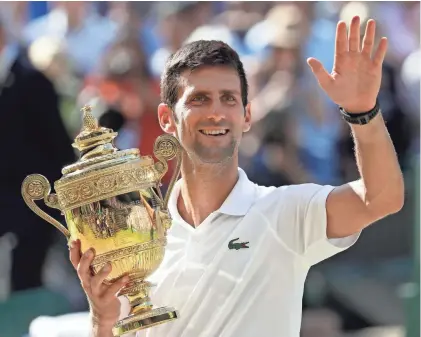  ?? ASSOCIATED PRESS ?? Novak Djokovic earned his 13th major trophy, the fourth-highest total in the history of men’s tennis. He had not won a Gland Slam title since the 2016 French Open.